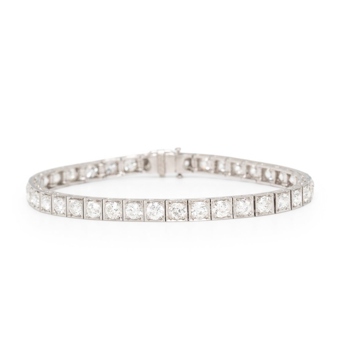 Art Deco, Platinum and Diamond Line Bracelet: Art Deco, Platinum and Diamond Line Bracelet Featuring old European cut diamonds weighing approximately 7.30 carats total. Mounted in platinum. 7 inches long. Gross weight: 11.30 dwt. Property from a 