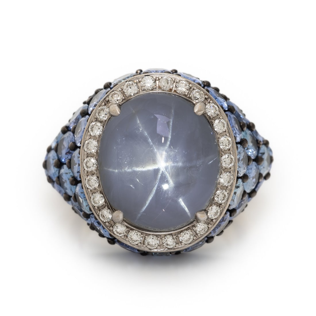 Robert Procop, Gray Star Sapphire, Sapphire, and Diamond 'Celebration' Ring: Robert Procop, Gray Star Sapphire, Sapphire, and Diamond 'Celebration' Ring Featuring an oval cabochon gray star sapphire weighing approximately 11.29 carats, with a halo of round brilliant cut diamon