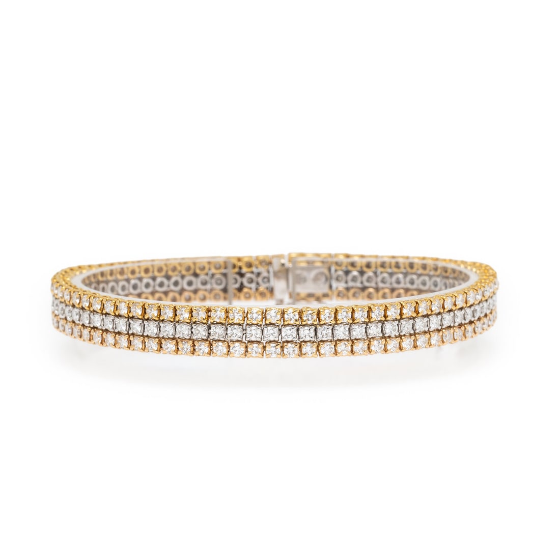 Diamond and Tricolor Gold Triple Line Bracelet: Diamond and Tricolor Gold Triple Line Bracelet Designed as three rows of round brilliant cut diamonds weighing approximately 8.60 carats total. Mounted in 18 karat yellow, white, and rose gold. 7 inch