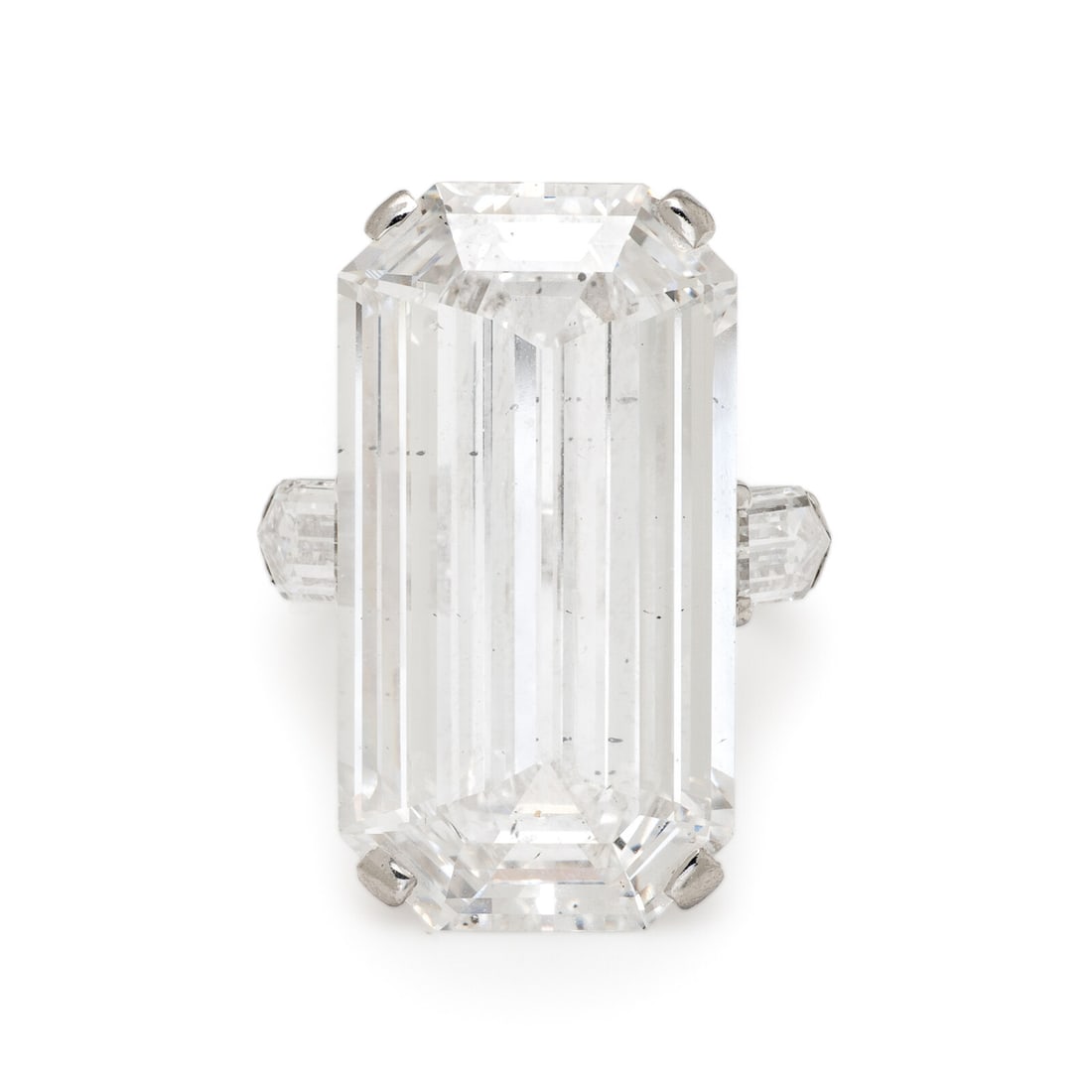 Important Diamond Ring: Important Diamond Ring Featuring an emerald cut diamond weighing 19.12 carats, flanked by bullet shape diamonds weighing approximately 1.35 carats total. Mounted in platinum. Ring size 4. Stamp: (part