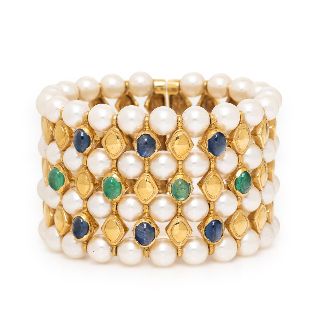 Cultured Pearl, Emerald, Sapphire, and Yellow Gold Cuff Bracelet: Cultured Pearl, Emerald, Sapphire, and Yellow Gold Cuff Bracelet With alternating rows of cultured pearls measuring approximately 7.50 - 7.75 mm and lozenge motifs, the front set with oval cabochon sa