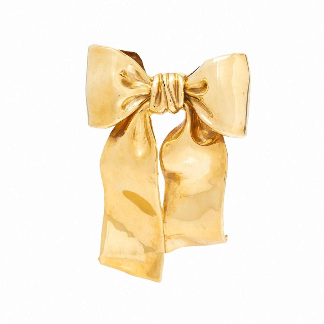 Yellow Gold Bow Brooch: Yellow Gold Bow Brooch Designed as a bow in a smooth finish. 18 karat yellow gold. 3 1/2 x 2 1/2 inches. Stamp: ITALY (Italian maker's mark) 18Kt. Gross weight: 28.80 dwt. Property from the Estate of 