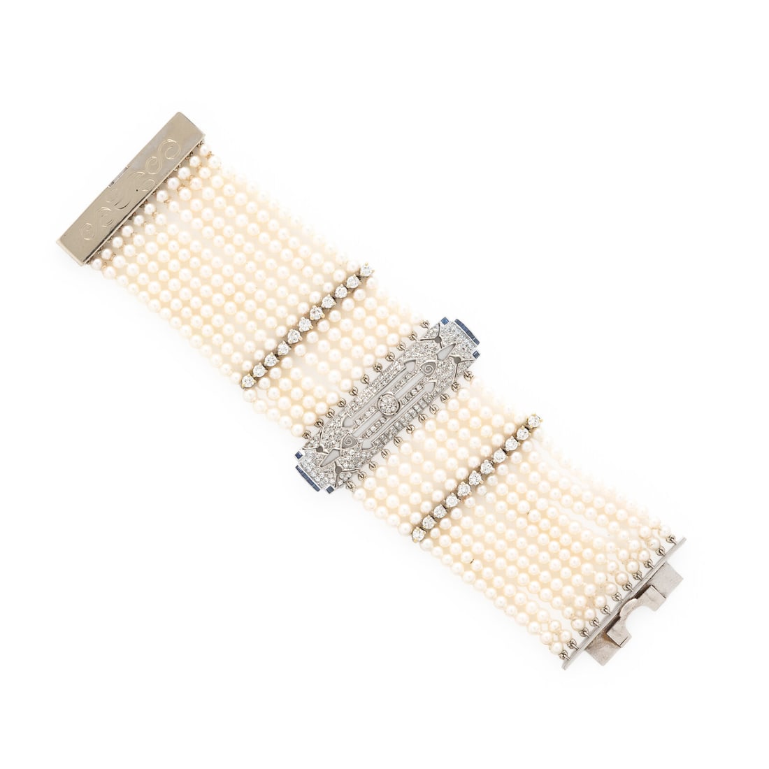Seed Pearl, Diamond, and Sapphire Bracelet: Seed Pearl, Diamond, and Sapphire Bracelet Featuring eleven strands of seed pearls measuring approximately 3.10 - 3.30 mm, calibré-cut sapphires, and single and transitional cut diamonds weighing