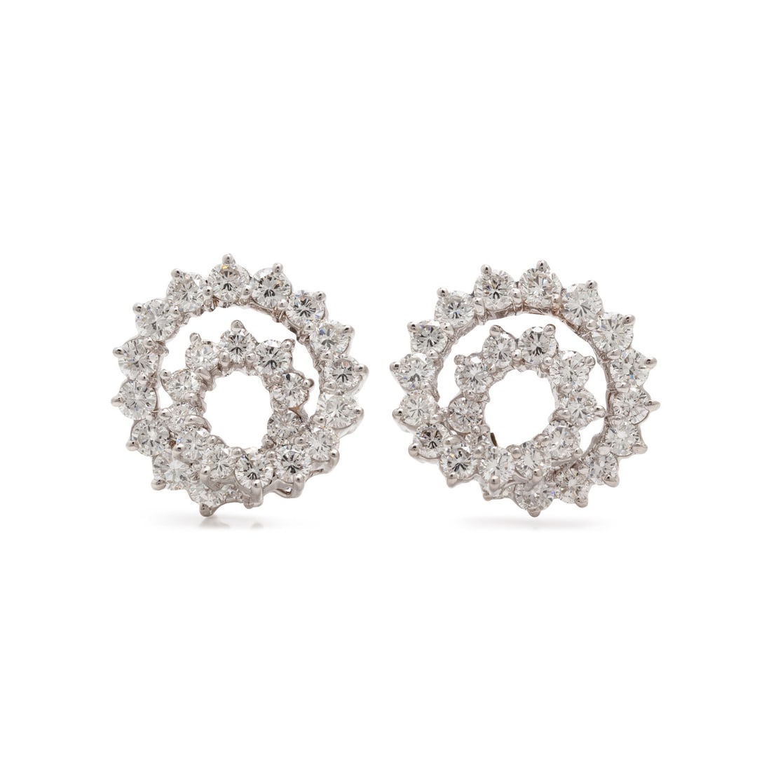 Diamond and White Gold Spiral Earrings: Diamond and White Gold Spiral Earrings In a spiral design, set throughout with round brilliant cut diamonds weighing approximately 4.30 carats total. Mounted in 18 karat white gold. 7/8 inch long. Sta