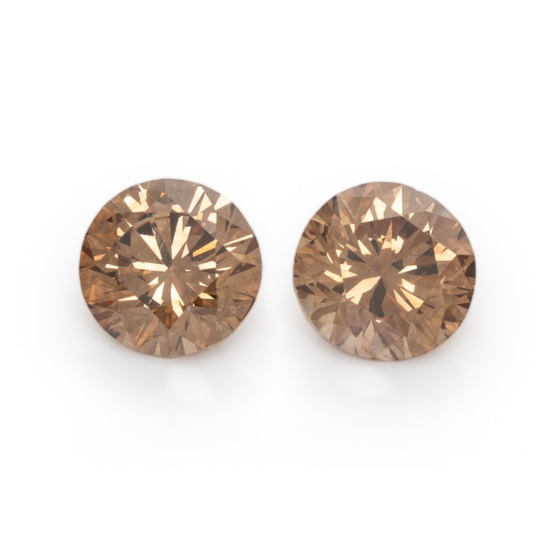 Pair of Fancy Dark Orange-Brown Diamonds: Pair of Fancy Dark Orange-Brown Diamonds Two unmounted Fancy Dark Orange-Brown round brilliant cut diamonds measuring 6.17 - 6.23 x 4.17 mm and 6.30 x 6.45 x 4.00. GIA, 2026, Report No. 13111709, 1.01