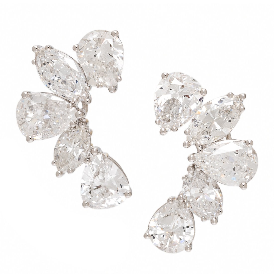 Diamond and White Gold Earrings: Diamond and White Gold Earrings Featuring pear shape and marquise cut diamonds weighing approximately 6.20 carats total. Mounted in 18 karat white gold. 7/8 inch long. Stamp: (maker's mark) 750. Gross