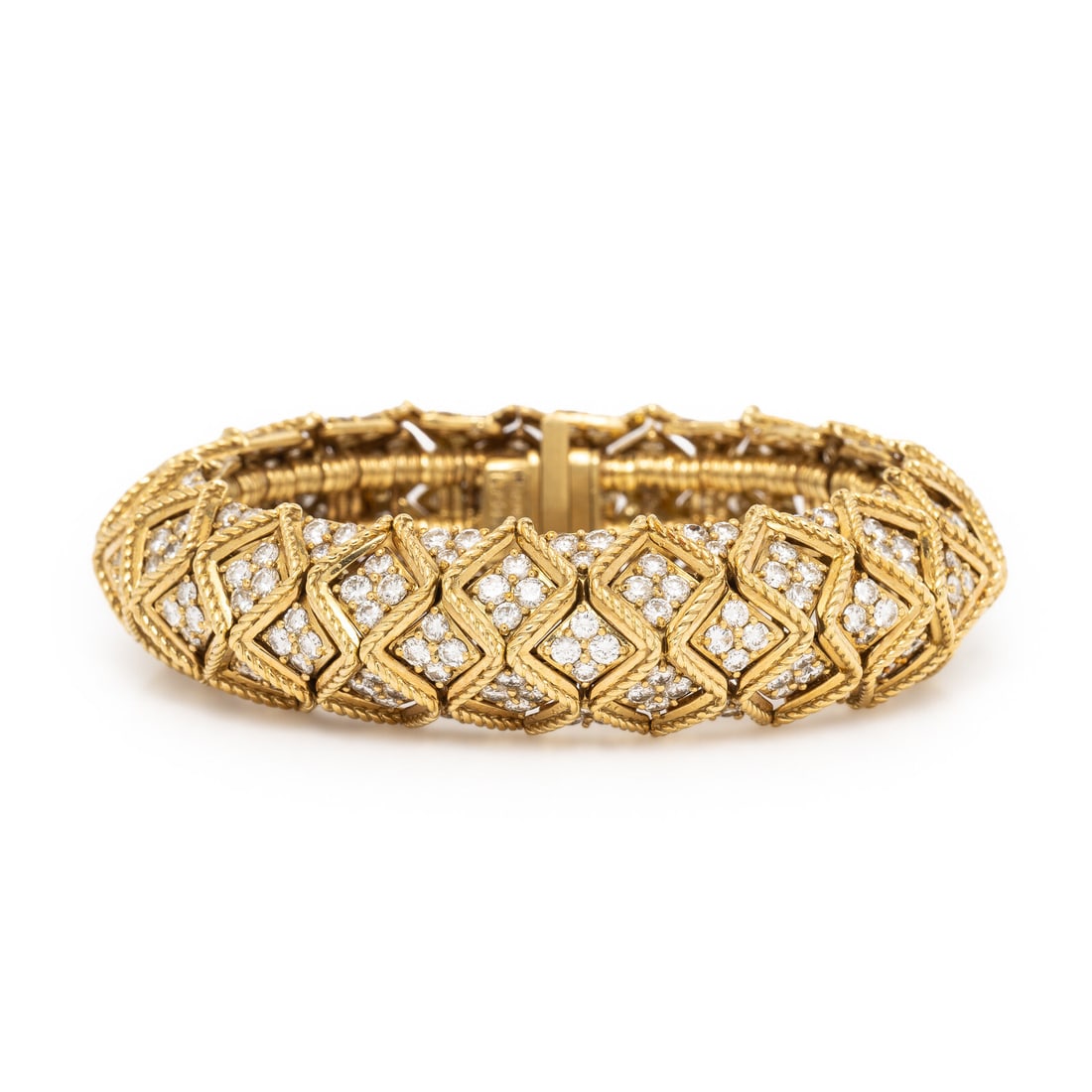 Hammerman Brothers, Yellow Gold and Diamond Bracelet: Hammerman Brothers, Yellow Gold and Diamond Bracelet Designed in a geometric pattern, set with round brilliant cut diamonds weighing approximately 16.50 - 19.50 carats total. Mounted in 18 karat yello