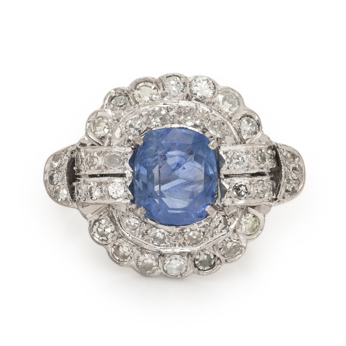 Art Deco, Sapphire and Diamond Ring: Art Deco, Sapphire and Diamond Ring Featuring a cushion cut sapphire weighing approximately 3.10 carats by formula, surrounded by single cut diamonds weighing approximately 1.50 carats total. Mounted 