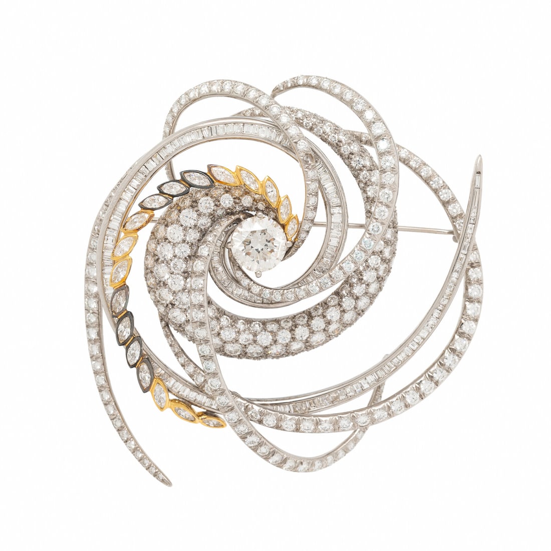 W. Kalich, Diamond, Platinum, and Yellow Gold Brooch: W. Kalich, Diamond, Platinum, and Yellow Gold Brooch In a swirled design, featuring a round brilliant cut diamond at the center weighing approximately 3.10 carats, with round brilliant, baguette, and 
