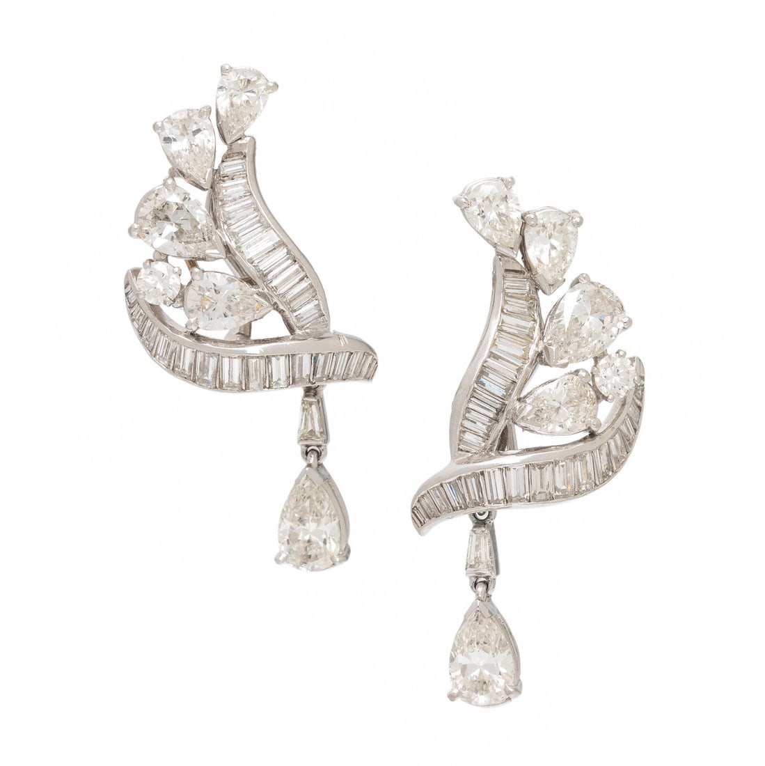 Diamond and Platinum Earrings: Diamond and Platinum Earrings In an abstract design with detachable drops, set with pear shape, round brilliant, baguette, and tapered baguette cut diamonds weighing approximately 6.75 carats total. M