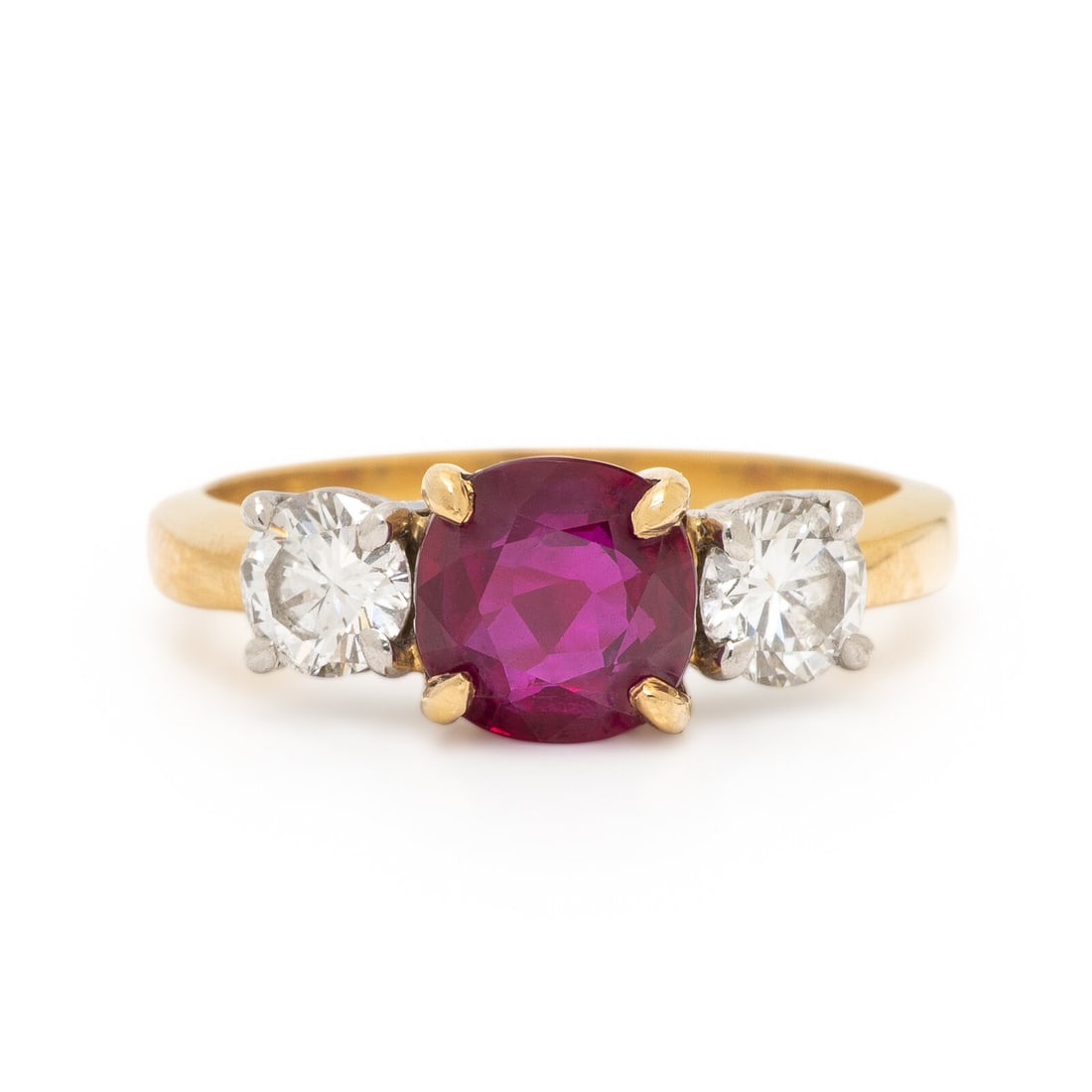 Burmese Ruby, Diamond, and Yellow Gold Ring: Burmese Ruby, Diamond, and Yellow Gold Ring Featuring a round ruby weighing approximately 1.91 carats by formula, flanked by round brilliant cut diamonds weighing approximately 0.70 carat total. Mount