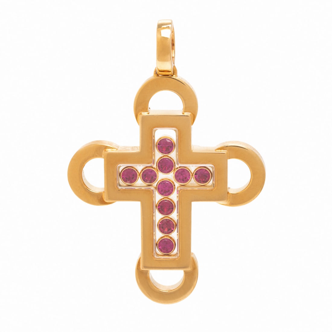 Chopard, Yellow Gold and Ruby Cross Pendant: Chopard, Yellow Gold and Ruby Cross Pendant In a stylized geometric design, containing floating bezel-set round rubies encased in rock crystal quartz, the front etched 'Chopard.' Mounted in 18 karat y