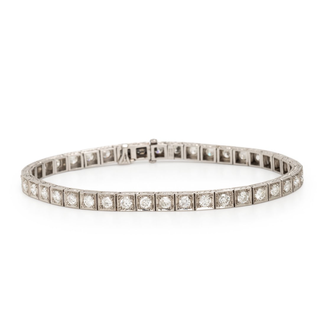 Art Deco, Diamond and Platinum Line Bracelet: Art Deco, Diamond and Platinum Line Bracelet Set with transitional cut diamonds weighing approximately 3.80 carats total. Mounted in platinum. 7 1/8 inches long. Stamp: PAT. FEB 29-1916. Gross weight: