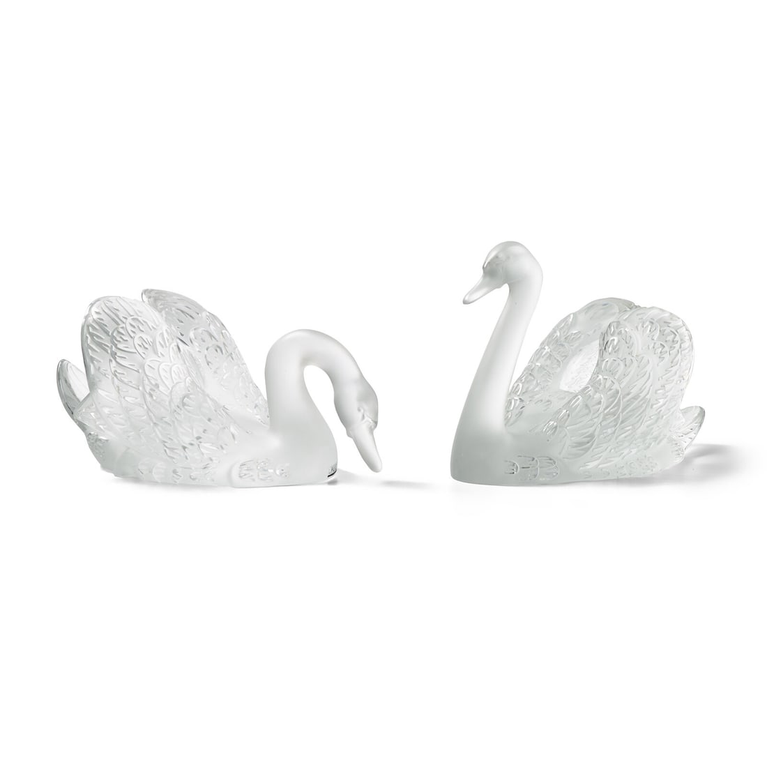 René Lalique (French, 1960–1945) Two Cygne sculptures: René Lalique (French, 1960–1945) Two Cygne sculptures etched glass 'Lalique' stickers present 9 h x 7 1/2 w x 12 1/2 d inches. | taller The Estate of the Honorable Sandra Schultz Newman Thi