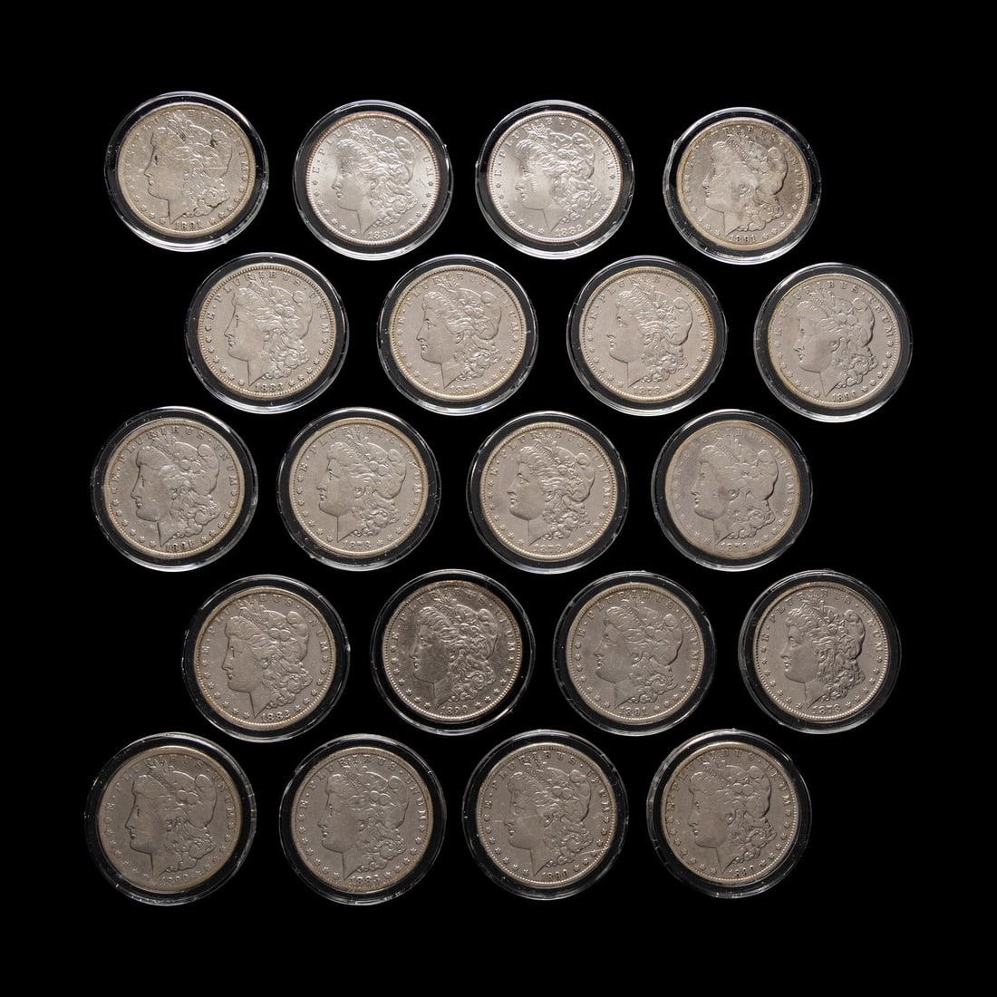 A Group of Twenty Carson City Mint Morgan $1 Coins: A Group of Twenty Carson City Mint Morgan $1 Coins comprising: 1878-CC (x5), 1879-CC, 1882-CC (x2), 1883-CC (x2), 1884-CC, 1890-CC (x5), 1891-CC (x4) This lot is located in Chicago.