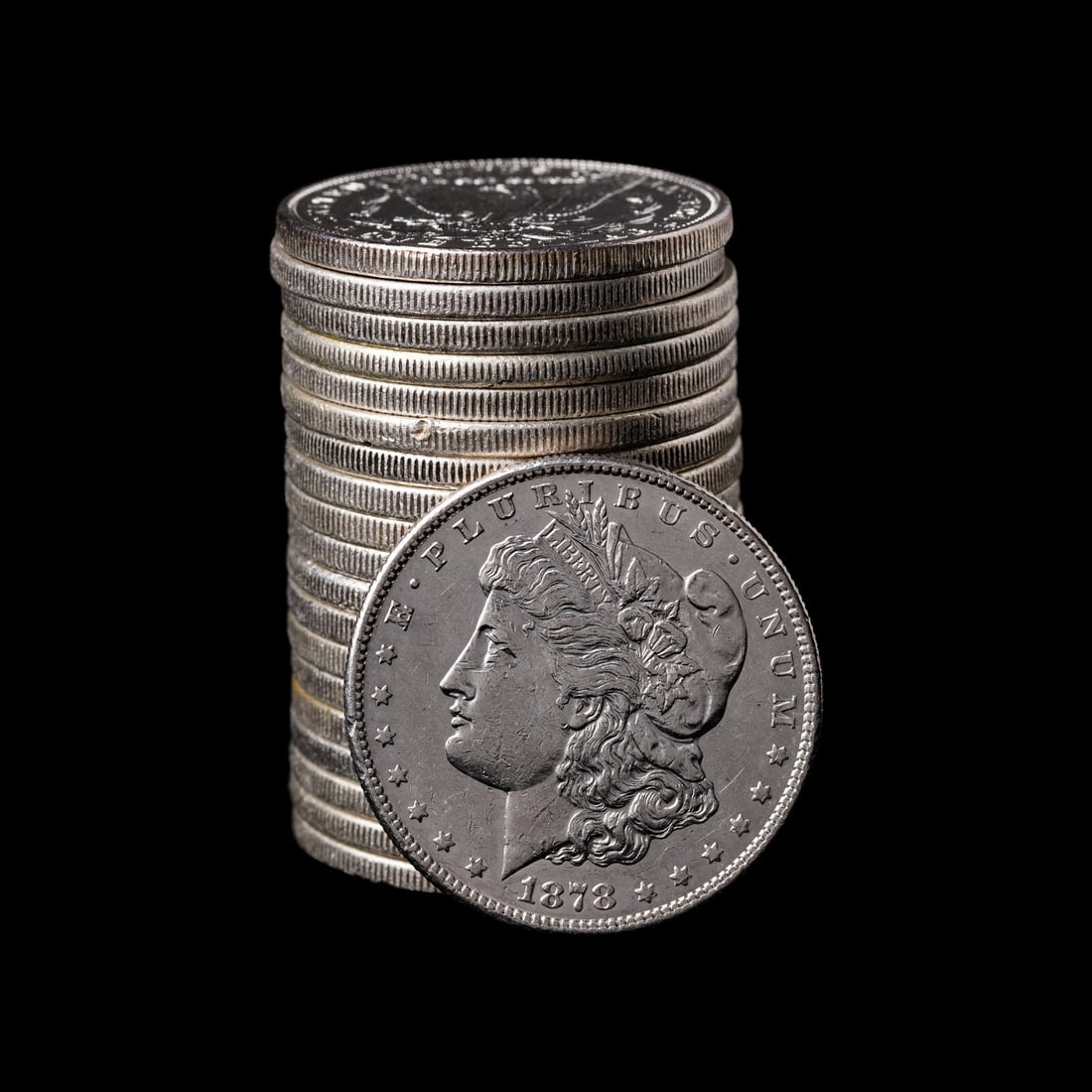 A Group of Twenty Morgan $1 Coins: A Group of Twenty Morgan $1 Coins comprising: 1878-S, 1879, 1880, 1881-O, 1883, 1885, 1886, 1888, 1889 (x2), 1890, 1890-S (x2), 1891-O, 1892, 1897, 1921 (x2) and 1921-S (x2) examples. This lot is loca