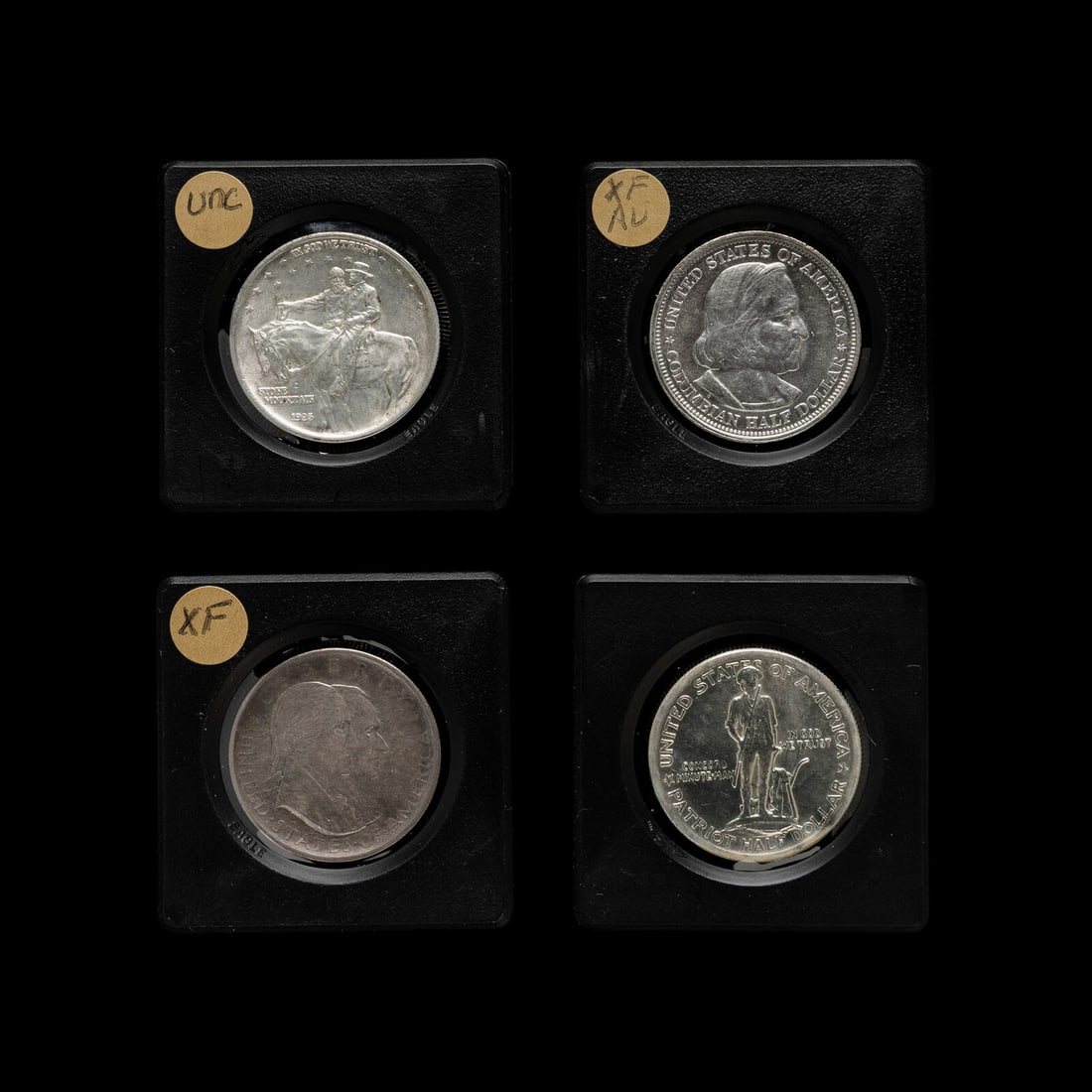 A Group of Four United States Commemorative 50c Coins: A Group of Four United States Commemorative 50c Coins comprising: 1892 Columbian Exposition , 1925 Stone Mountain, 1925 Lexington and Condord, 1926 Sesquicentennial. This lot is located in Chicago.