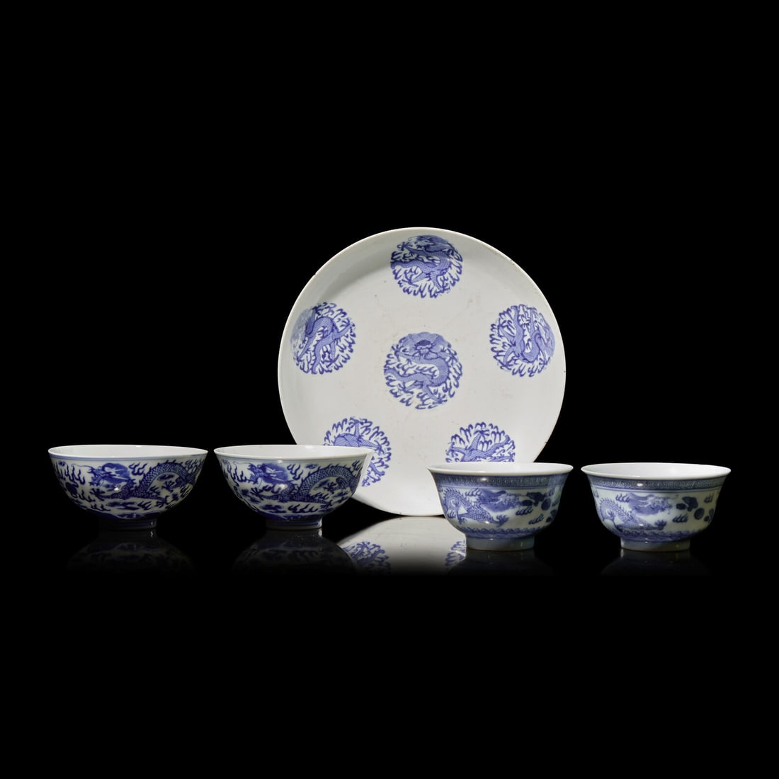 A Group of Five Assorted Chinese Blue and White "Dragons" Cups and Bowls, 19th-20th Century: A Group of Five Assorted Chinese Blue and White "Dragons" Cups and Bowls, 19th-20th Century 青花云龍紋碗盤一組五件 Comprising a dish w