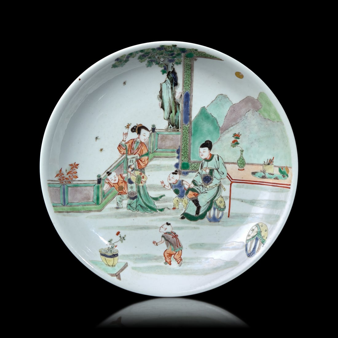 A Chinese Famille Verte Porcelain Dish: A Chinese Famille Verte Porcelain Dish 五彩人物圖盤 The interior is decorated with children playing before a seated scholar and a meiren, all beautifully painted, w