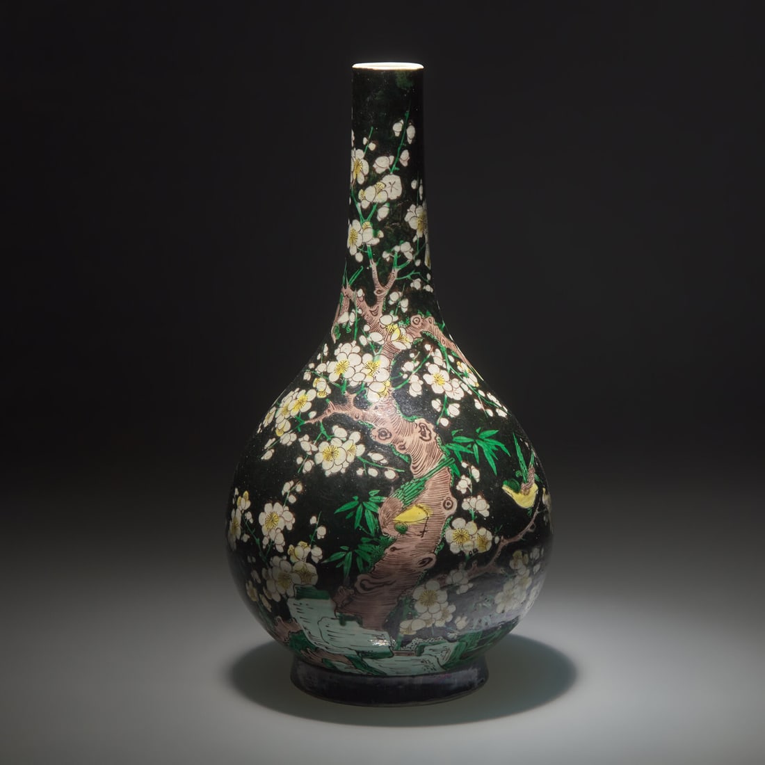 A Chinese Famille Noir Bottle Vase, Qing Dynasty: A Chinese Famille Noir Bottle Vase, Qing Dynasty 清 墨彩喜上眉梢賞瓶 Overall decorated with prunus and magpie, the underside with a blue and white