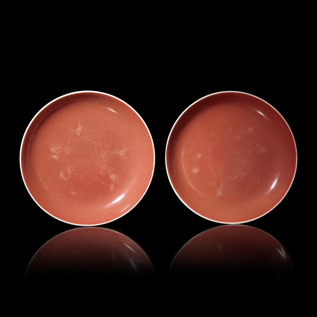 A Pair of Chinese Copper Red-Glazed Dishes, Qing Dynasty, 18th/Early 19th Century: A Pair of Chinese Copper Red-Glazed Dishes, Qing Dynasty, 18th/Early 19th Century 清中期 紅釉賞盤一對 Of an even red color, raised on a short circ
