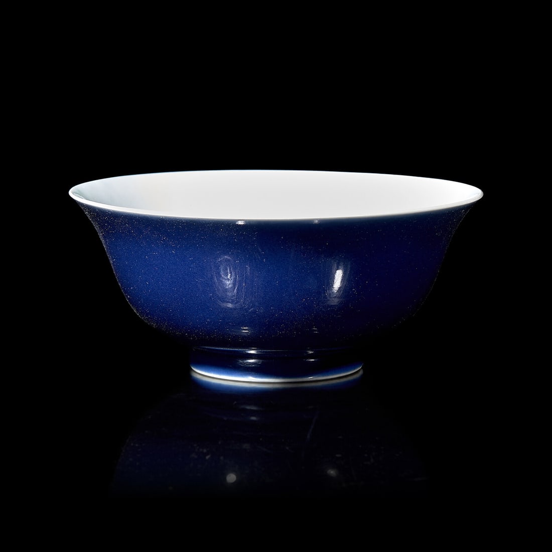 A Chinese Blue Glazed Porcelain Bowl, Qianlong Mark and Possibly of the Period: A Chinese Blue Glazed Porcelain Bowl, Qianlong Mark and Possibly of the Period 或为清乾隆 霽藍釉碗 With flared lip, low circular foot, the exterio