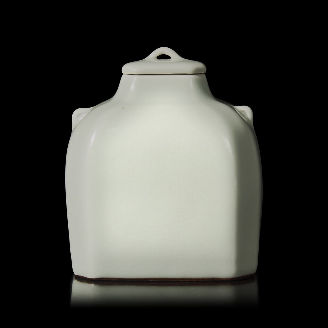 A Chinese Celadon Glazed Covered Jar, Qianlong Mark: A Chinese Celadon Glazed Covered Jar, Qianlong Mark 乾隆款 青釉雙係蓋罐 With the Qianlong mark to the underside. Height with lid 5 3/8 in., 13.6 c