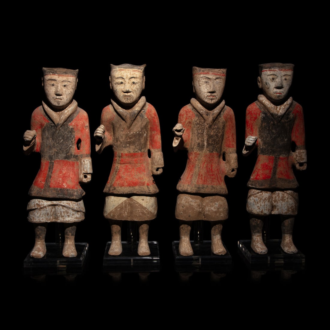 Four Chinese Painted Pottery Soldiers, Han Dynasty: Four Chinese Painted Pottery Soldiers, Han Dynasty 漢 彩繪步兵陶俑四件 Height 18 1/2 in., 47 cm. This lot is located in Chicago. Provenance: Acqui