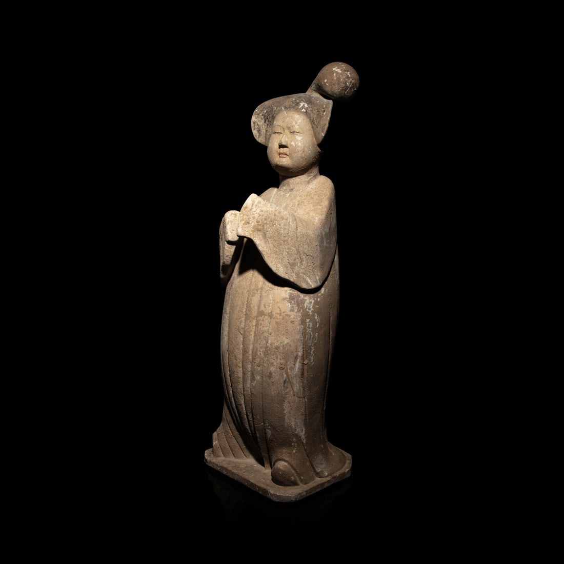 A Large Chinese Painted Pottery Court Lady, Tang Dynasty: A Large Chinese Painted Pottery Court Lady, Tang Dynasty 唐 灰陶加彩仕女俑 Dressed in a long voluminous robe falling in crisp folds to the feet, with th