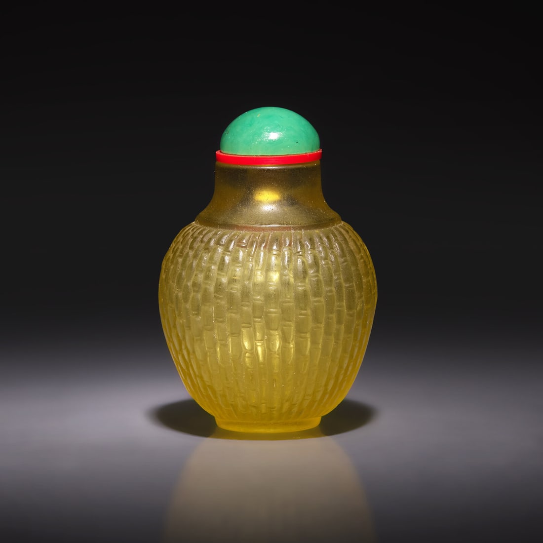 A Chinese Pale Yellow Glass "Basketweave" Snuff Bottle, Qianlong Mark: A Chinese Pale Yellow Glass "Basketweave" Snuff Bottle, Qianlong Mark 乾隆款 黃料簸籮紋鼻烟壺 Of tapered spherical form, with low wais