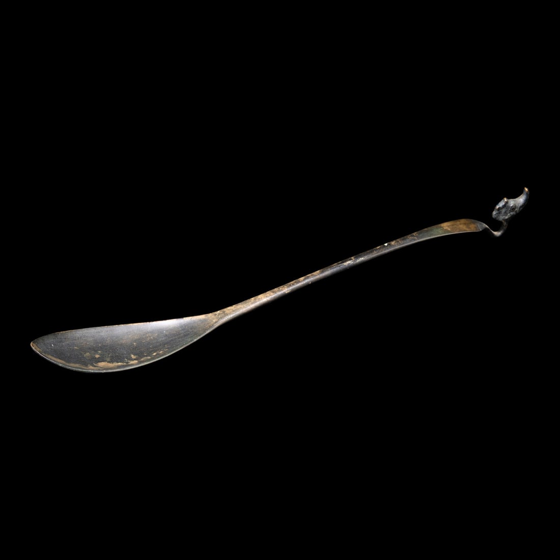 A Chinese Silver 'Dragon-Handle' Tea Ladle, Liao Dynasty: A Chinese Silver 'Dragon-Handle' Tea Ladle, Liao Dynasty 辽 银龙首茶匙 Length 10 5/8 in., 27 cm. This lot is located in Philadelphia.