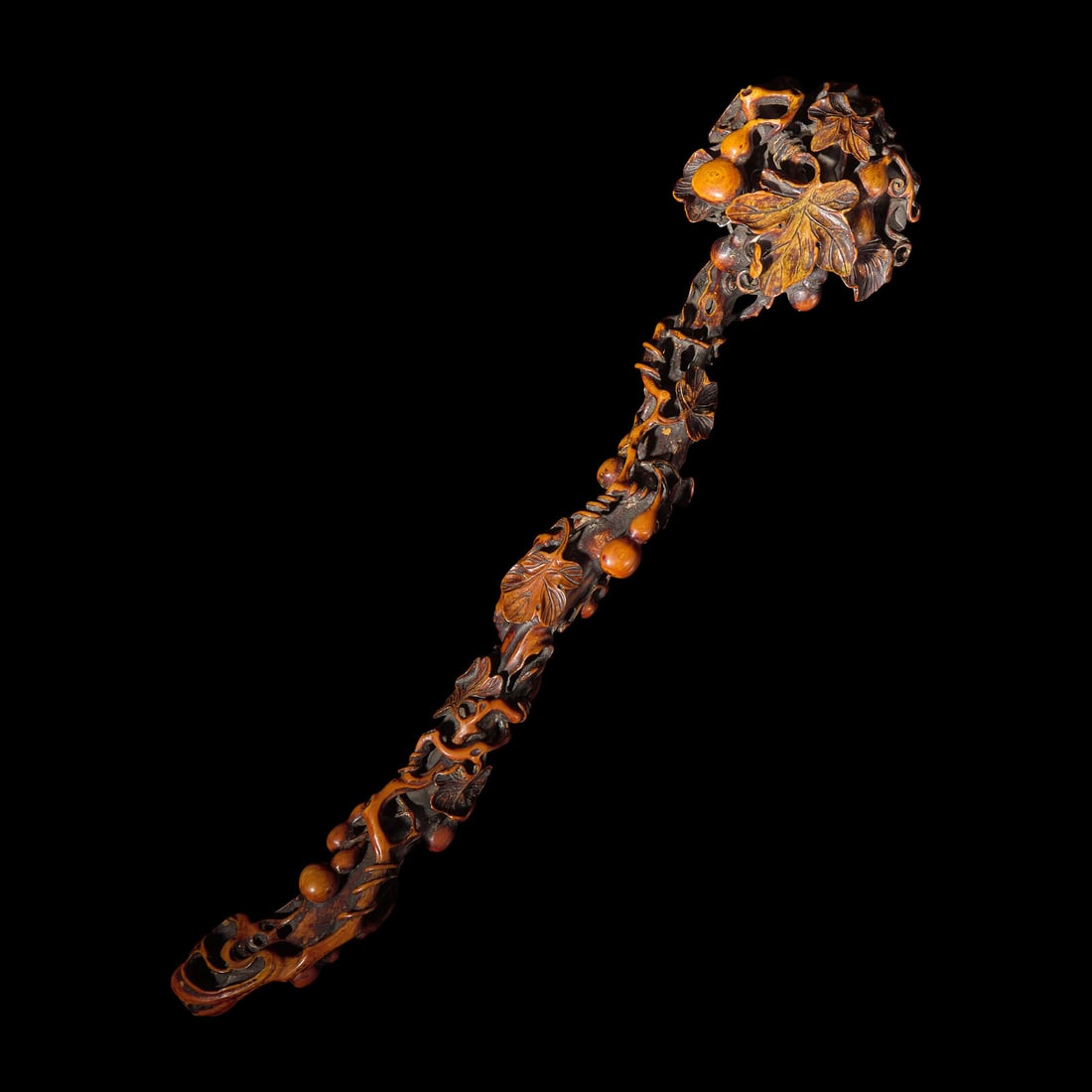A Chinese Finely Carved Stained Bone Ruyi Scepter, Qing Dynasty (1 of 4)