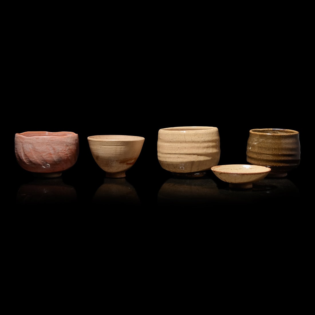 A Group of Four Assorted Japanese Chawan and a Sake Cup, Primarily 20th Century (1 of 3)
