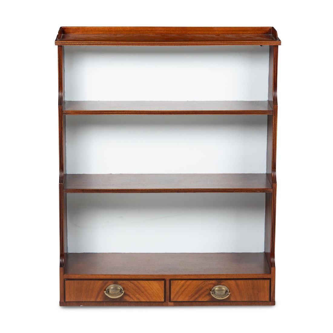 An English Mahogany Hanging Etagere: An English Mahogany Hanging Etagere 19th Century Height 30 1/2 x width 24 1/2 x depth 9 inches. Property from the Collection of Patricia and Michael Corbett, Kenilworth, Illinois This lot is located i