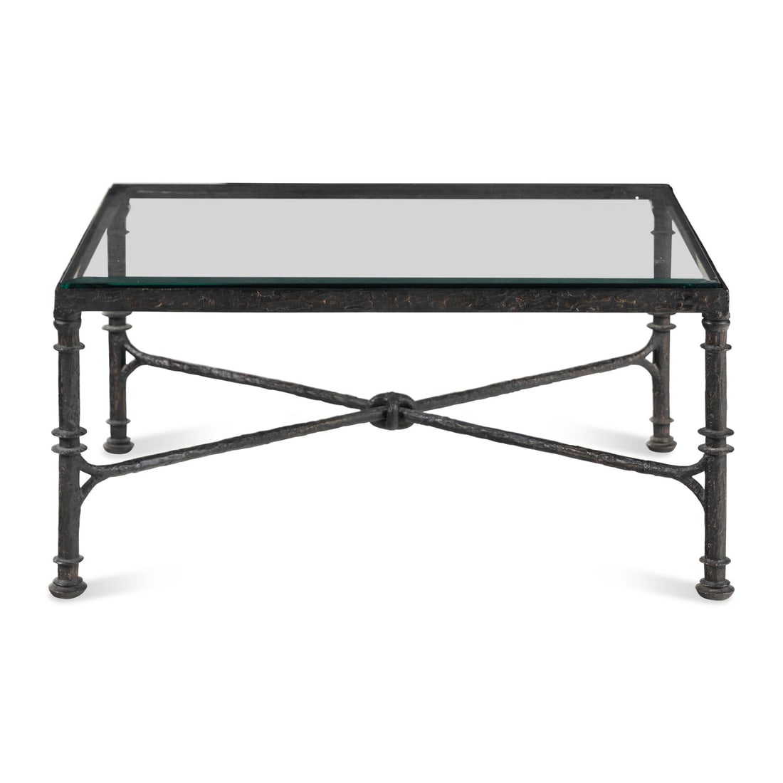 A Bronze and Glass Cocktail Table: A Bronze and Glass Cocktail Table Style of Diego Giacometti, 20th Century Height 19 x width 40 x depth 30 inches. Property from the Collection of James and Judith Klutznick, Chicago, Illinois This lot