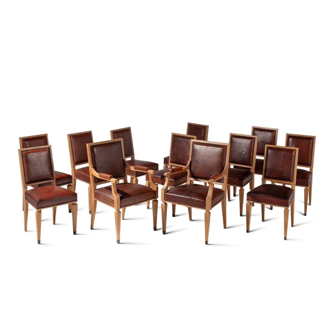 A Set of Twelve Leather-Upholstered Cerused Oak Dining Chairs (1 of 2)