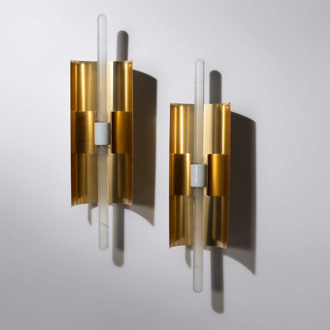 A Pair of Brass and Glass Sconces: A Pair of Brass and Glass Sconces Height (without bulb) 14 1/2 x width 6 x depth 3 1/2 inches. This lot is located in Chicago.
