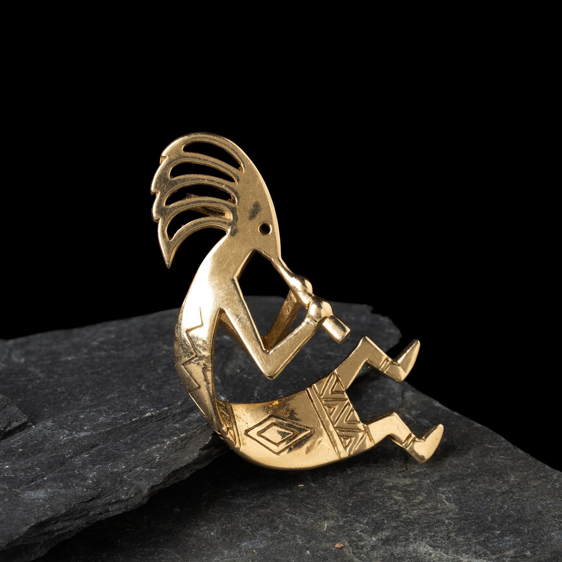 Southwestern-style 14K Gold Kokopelli Pendant: Southwestern-style 14K Gold Kokopelli Pendant ca 2000 marked 14K with unidentified sun hallmark length 1-3/4 inches x width 1 inch weight 6.25 dwt. From the Private Collection of Lady Marmalade This