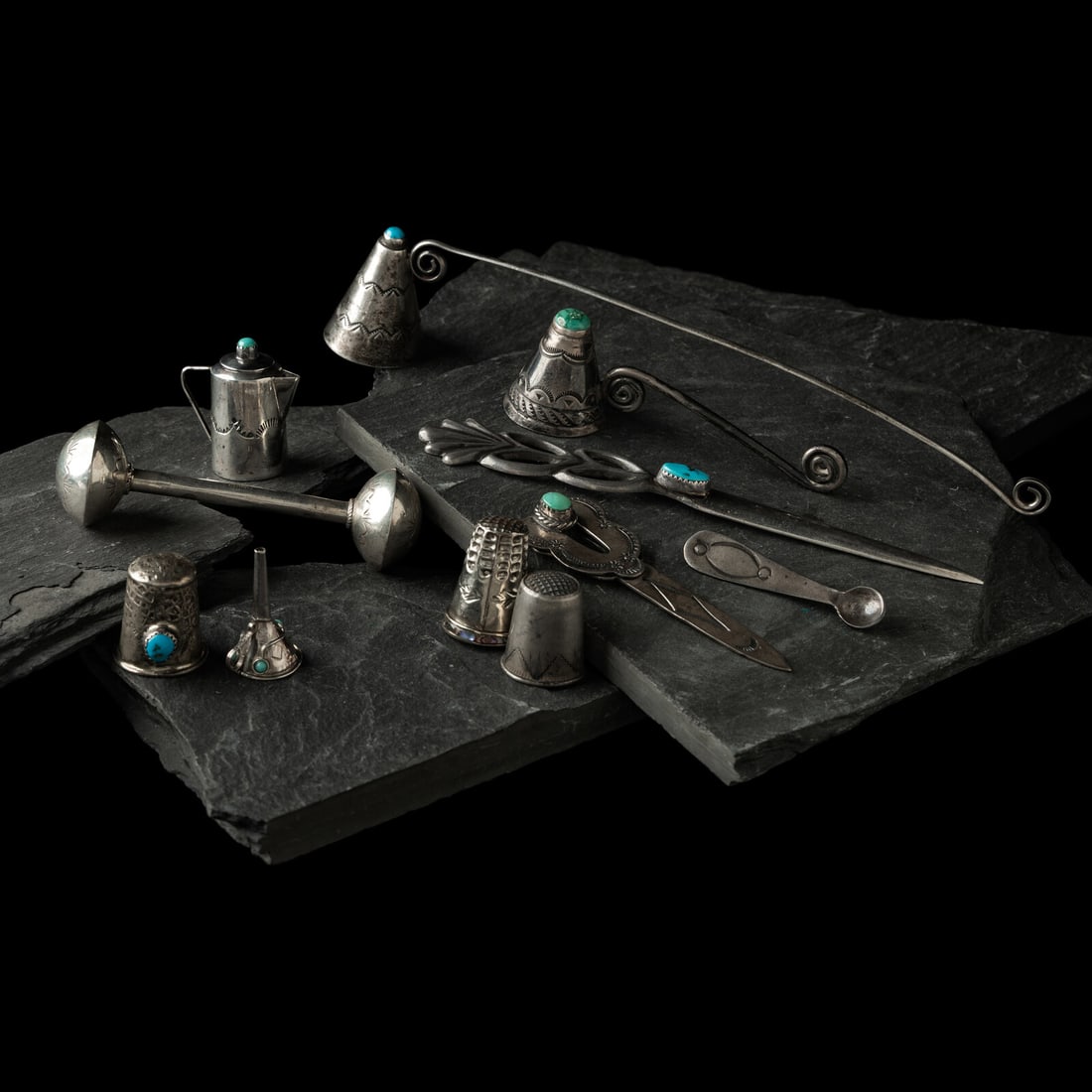 Navajo Silver Curio Pieces, PLUS: Navajo Silver Curio Pieces, PLUS first half 20th century lot of 11, includes: a pair of stamped candle snuffers; each set with a single turquoise cabochon; not marked length 7 inches length 3-1/8