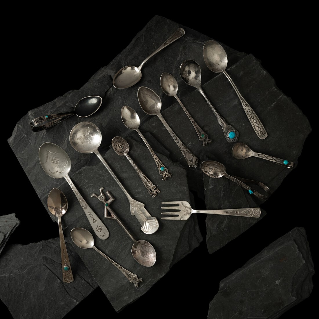 Navajo Silver Curio Cutlery: Navajo Silver Curio Cutlery 20th century lot of 16, spoons and fork with various decorations, includes: three marked STERLING lengths 4-1/2 inches, 3-5/8 inches, and 4-3/8 inches total combined