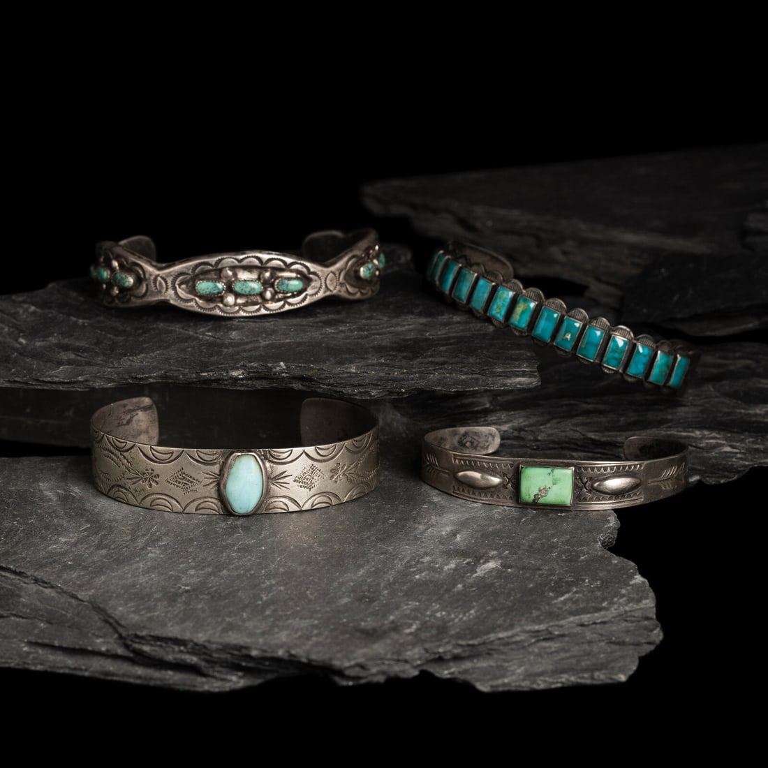Navajo Silver and Turquoise Cuff Bracelets, PLUS: Navajo Silver and Turquoise Cuff Bracelets, PLUS first half 20th century lot of 4, none are marked, includes: one example set with a row of nine stones in a scalloped band width 5/8 inch interior circ