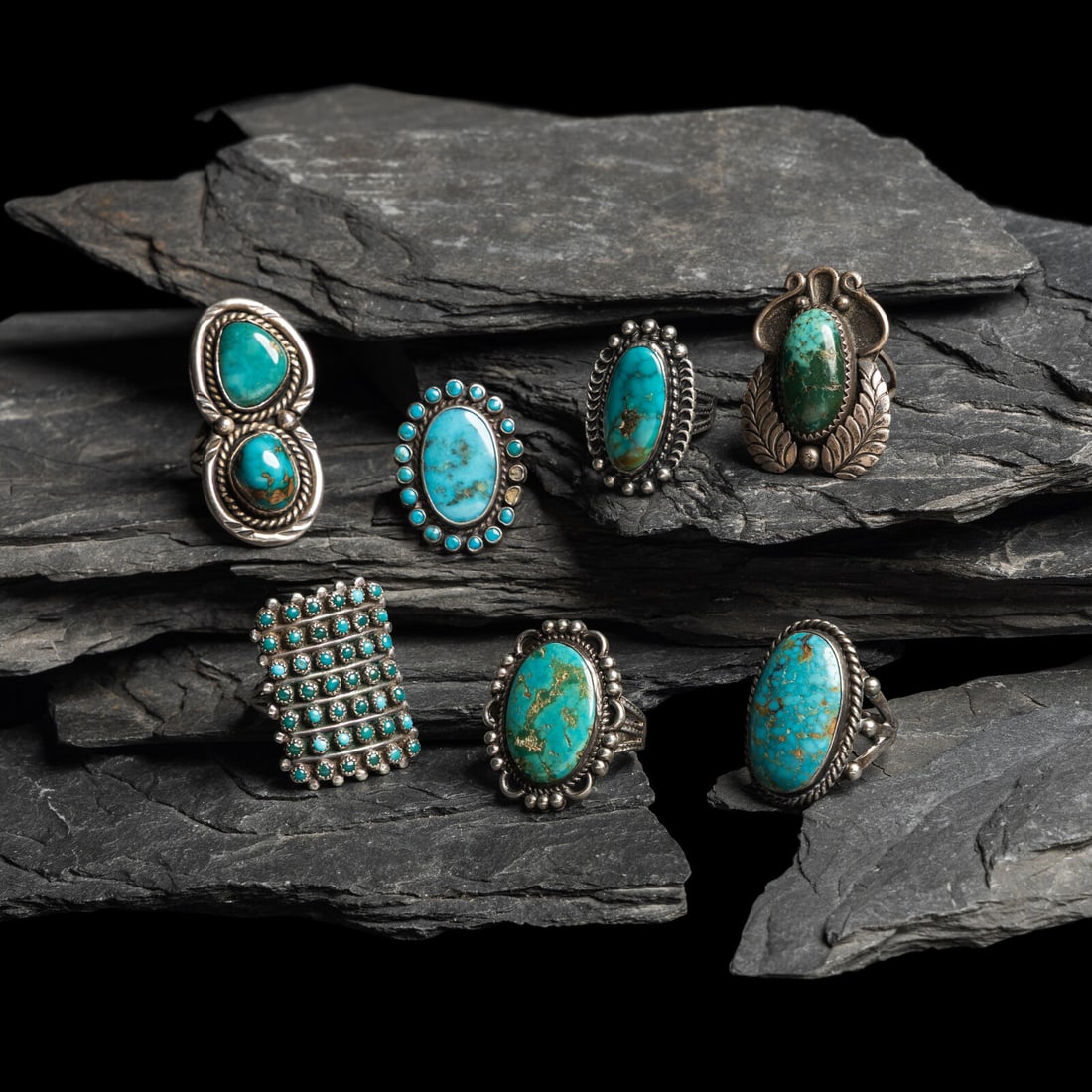Navajo Silver and Turquoise Rings: Navajo Silver and Turquoise Rings first half 20th century lot of 7, none are marked, includes: sizes: 8, 7, 8.25, 5.75, 6, 5.75, and 6.5 total combined weight 42.1 dwt. This lot is located in Chicago.