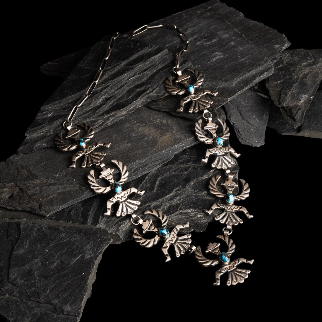 Horace Iule, Attributed (Zuni, 1901-1978) Silver Knifewing and Persian Turquoise Necklace: Horace Iule, Attributed (Zuni, 1901-1978) Silver Knifewing and Persian Turquoise Necklace seven linked Knifewing figures, each set with a single cabochon; not marked length 23 inches weight 75.1 dwt. 