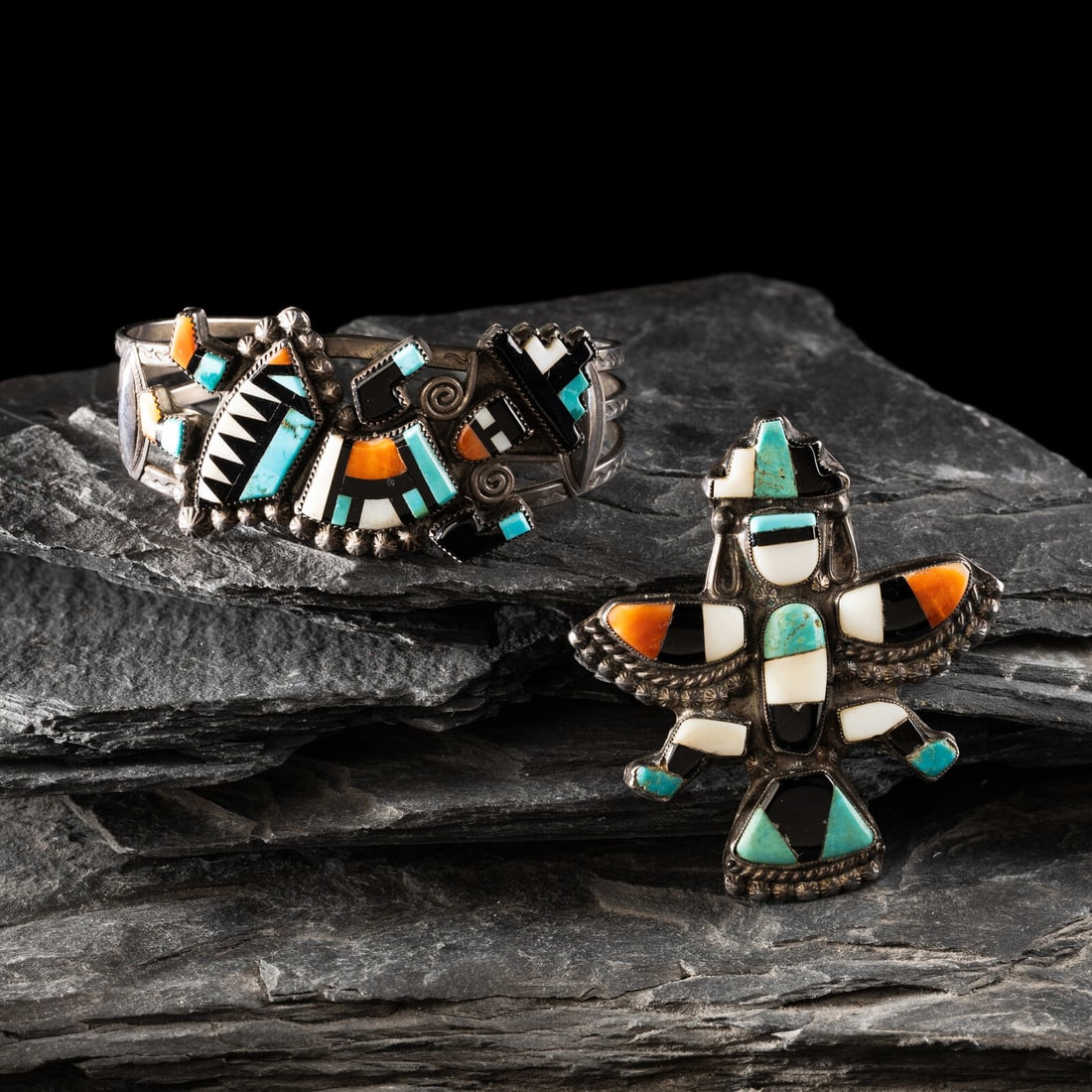 Zuni Mosaic Inlay Pin and Cuff Bracelet: Zuni Mosaic Inlay Pin and Cuff Bracelet mid-20th century lot of 2, includes: silver wire cuff bracelet with stamping along the edges, featuring a turquoise, jet, shell, and spiny oyster mosaic inlay