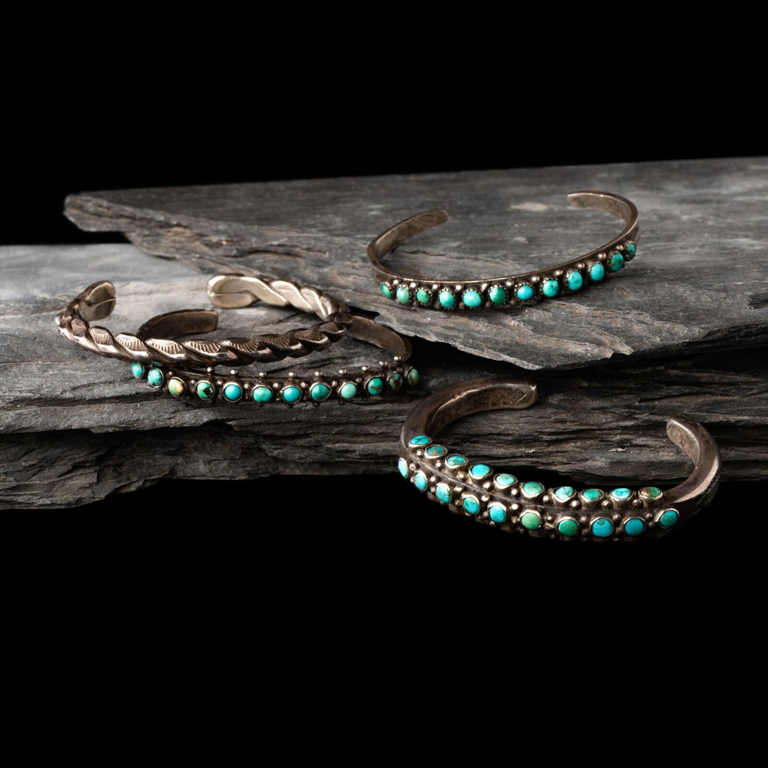 Navajo Slender Cuff Bracelet: Navajo Slender Cuff Bracelet second quarter - mid 20th century lot of 4, none are marked, includes: one set with three rows of turquoise stones with a stamped bezel width 3/8 inch interior circumferen