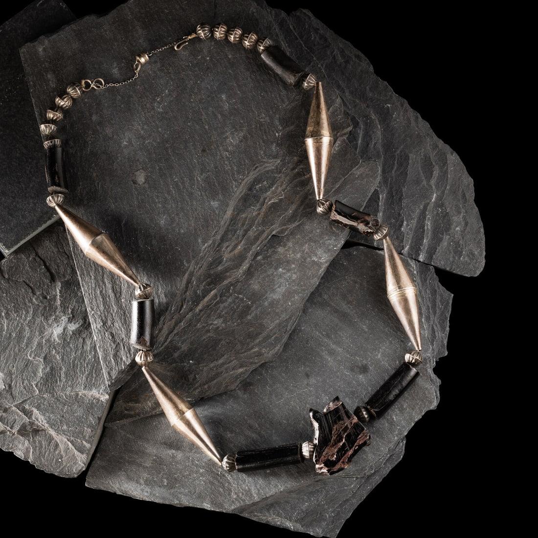Joe H. Quintana, Attributed (Cochiti, 1915-1995) Sterling Silver and Black Coral Necklace: Joe H. Quintana, Attributed (Cochiti, 1915-1995) Sterling Silver and Black Coral Necklace not marked length 23-1/4 inches weight 30.1 dwt. This lot is located in Chicago.