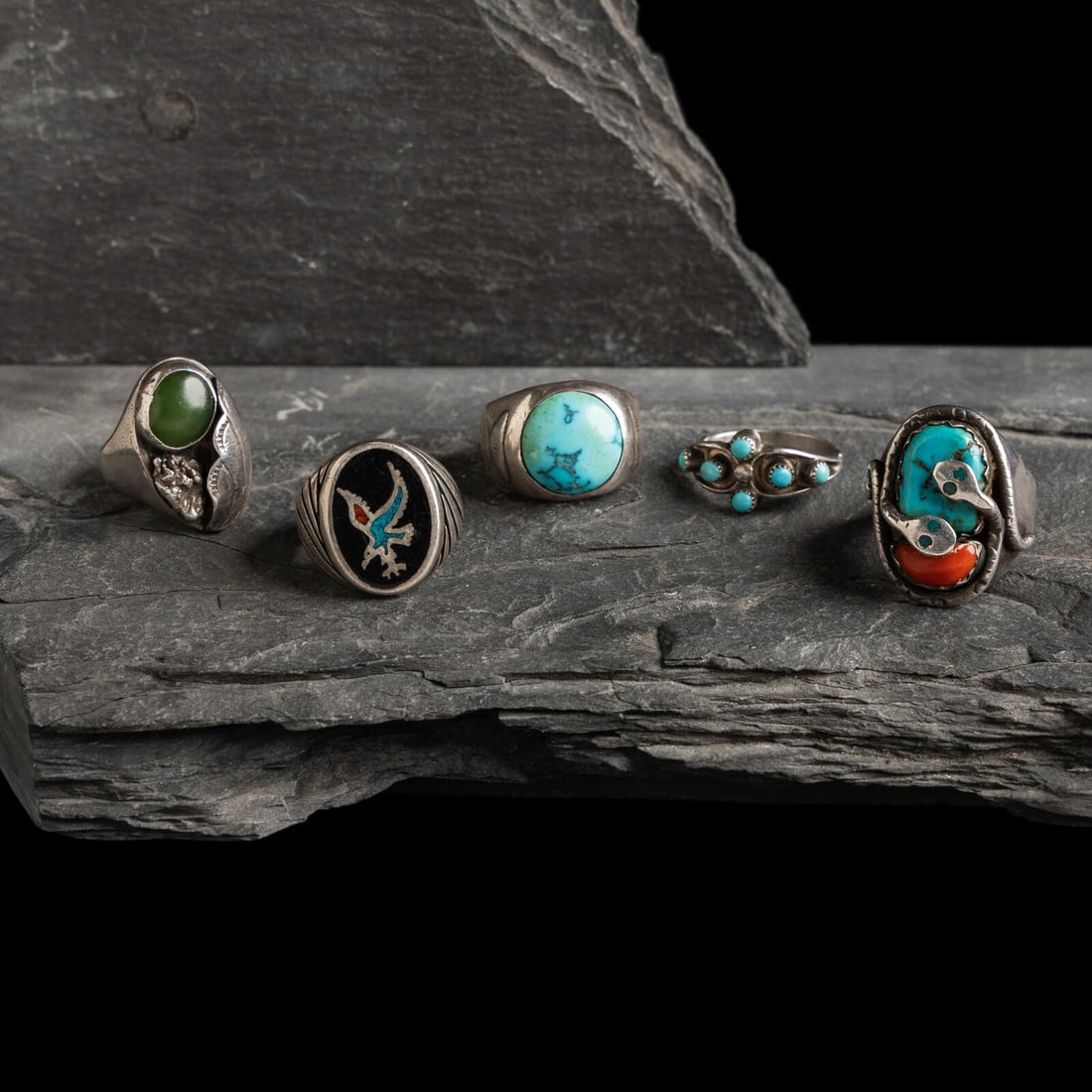 Navajo, Zuni, and Southwestern-stye Rings: Navajo, Zuni, and Southwestern-stye Rings mid-20th century lot of 5, includes: as coral and turquoise with snake design; marked Effie C ZUNI size 11 weight 14.5 dwt. one with a simple band and single