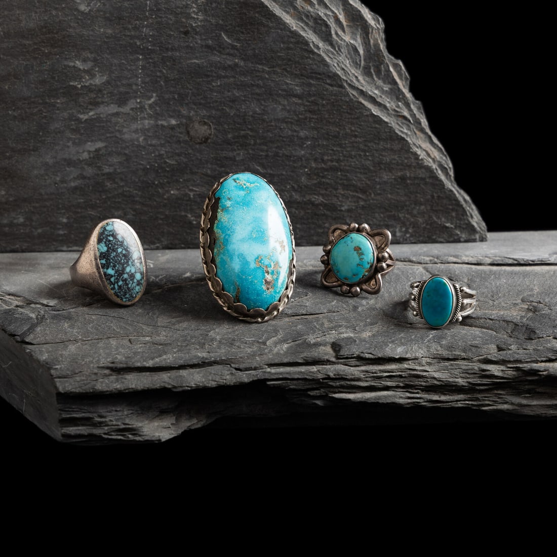 Navajo Silver and Turquoise Rings: Navajo Silver and Turquoise Rings second quarter - mid 20th century lot of 4, none are marked, includes: a large men's split shank example size 12.75 face length 2 inches x width 1-1/4 inches weight