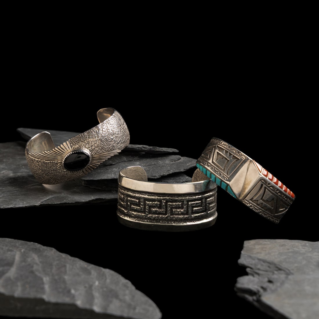 Navajo Silver Cuff Bracelets with Inlay: Navajo Silver Cuff Bracelets with Inlay late 20th century lot of 3, includes: on example set with a single onyx cabochon; marked AY STERLING width 1 inch interior circumference 5-3/4 inches + gap leng