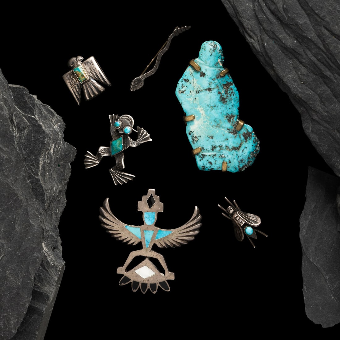 Group of Navajo and Pueblo Pins / Brooches: Group of Navajo and Pueblo Pins / Brooches mid-20th century lot of 6, includes: a stamped silver snake pin; not marked length 2 inches weight 1.4 dwt. a silver frog set with three turquoise stones;